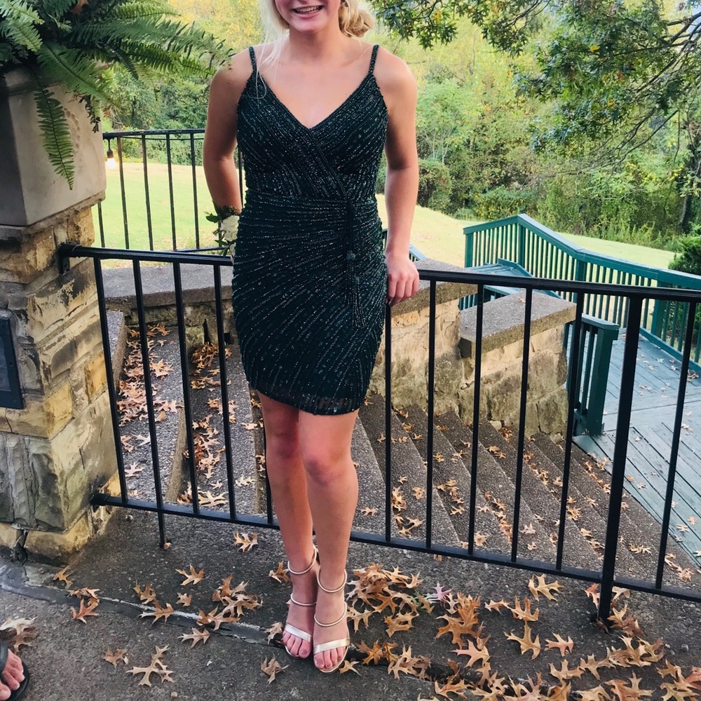HOCO or winter formal dress. Teal green size 2. Worn once, perfect condition.